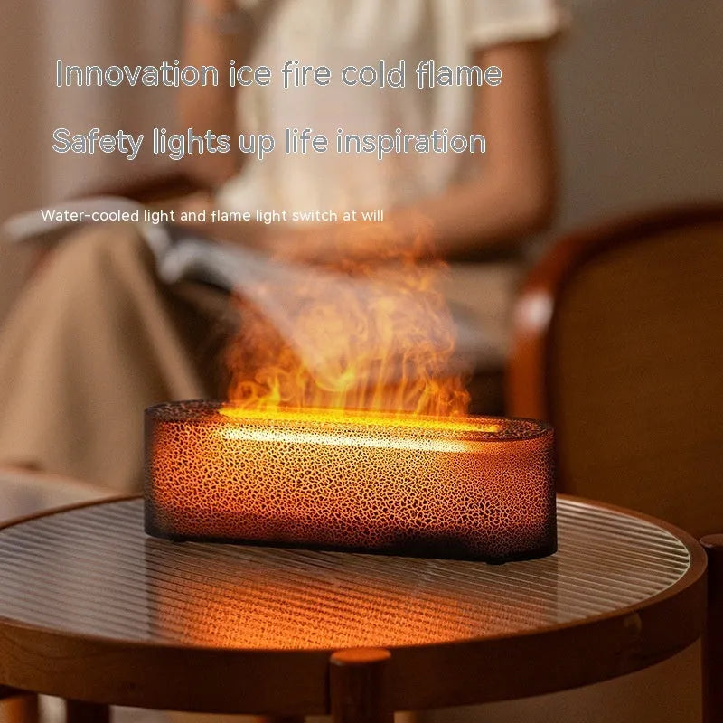 Square-shaped lava lamp-style USB aroma diffuser humidifier with colourful flame light effect on a desk.