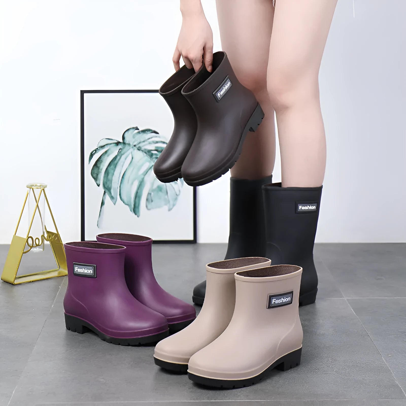 Women's mid-calf PVC rain boots in black colour with low heel