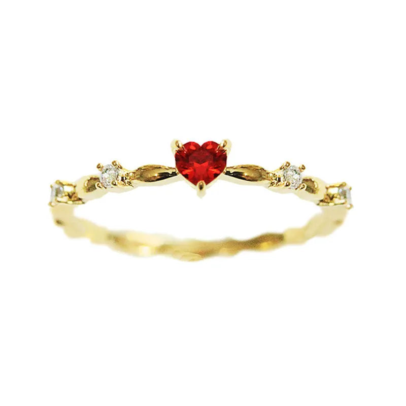 Gold or silver colour peach heart shaped ring with zircon stones on a copper band.