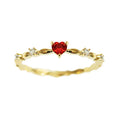 Gold or silver colour peach heart shaped ring with zircon stones on a copper band.