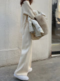 Women's high waist knitted wide-leg trousers in cream white colour with dropped mopping style