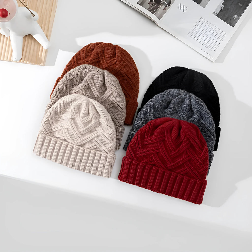 Wool knitted dome hat with totem pattern in ivory white, shown from side angle