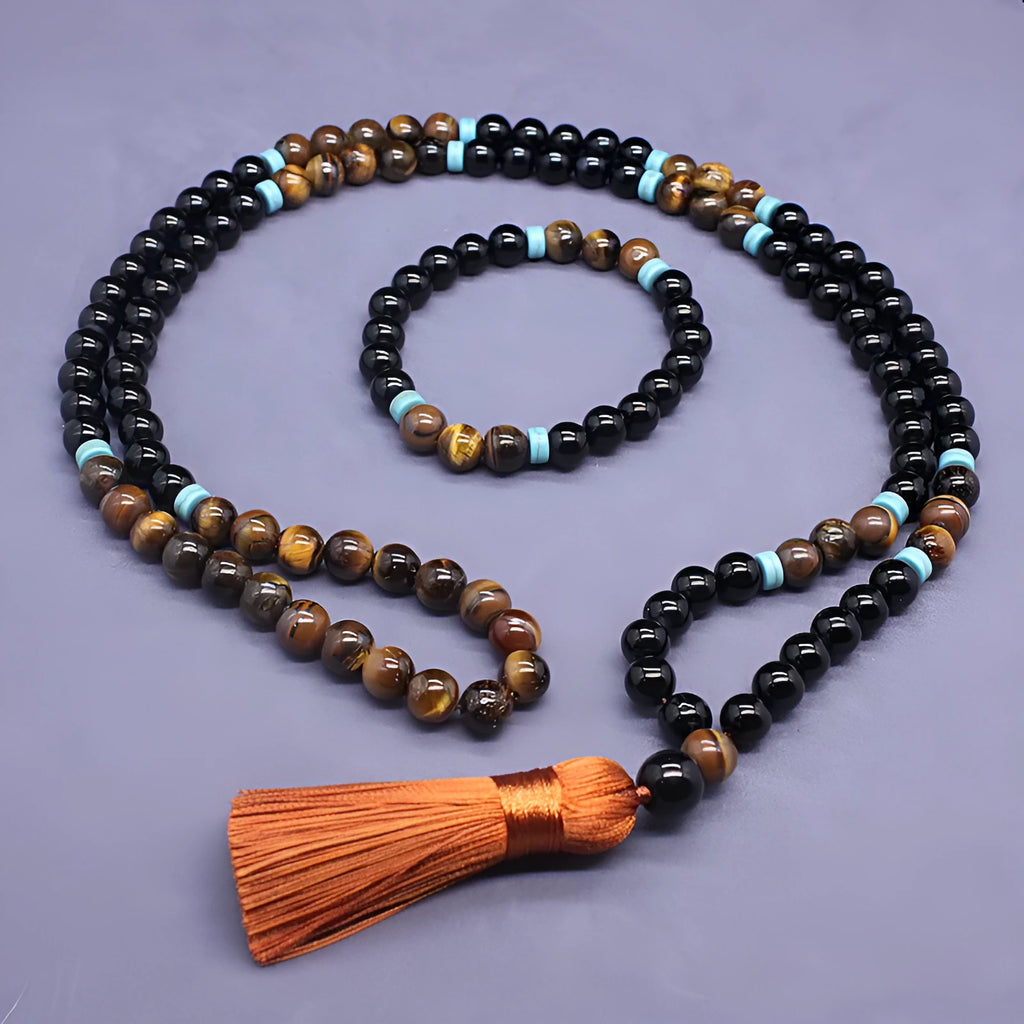 Natural agate and tigereye bead jewellery set showing black agate bracelet and necklace with tiger-shaped stone.