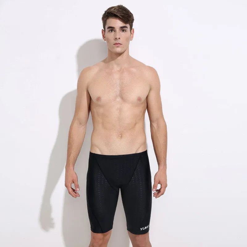 Men's black polyester swimming set with trunks, anti-fog goggles, waterproof cap, ear plugs, nose clip, and carry bag
