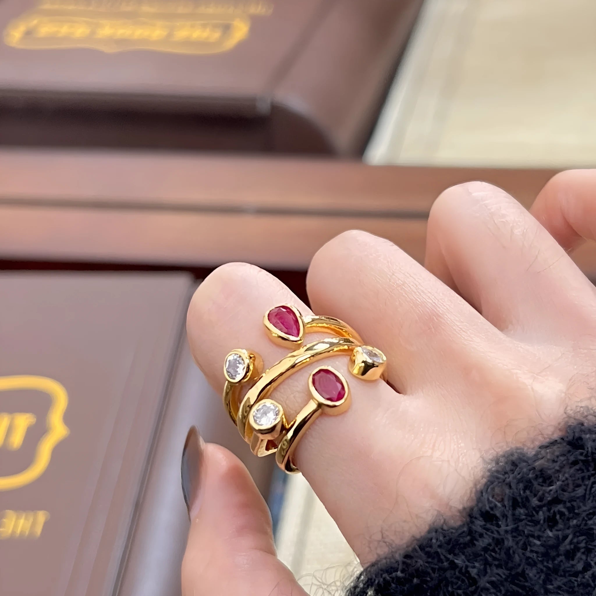 Copper geometric ring with irregular cross design and two-colour electroplated diamond decoration