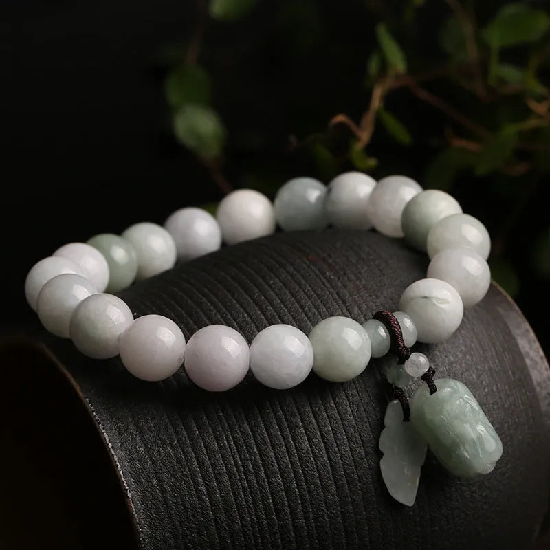 Natural jade hanging bracelet with carved pendant showing geometric design