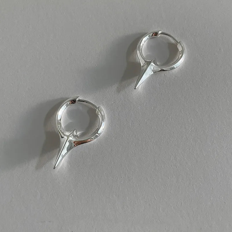 Women's geometric star-shaped ear clip earrings with a copper white gold electroplated finish.