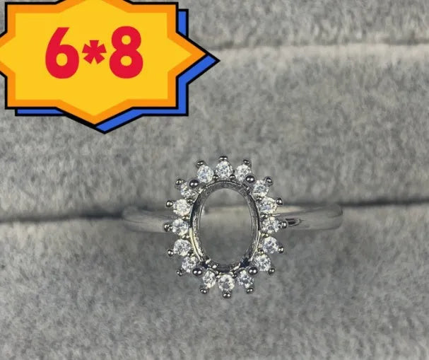 Oval denier ring ornament with 6x8mm stone, open mouth design, and five-pointed star detail