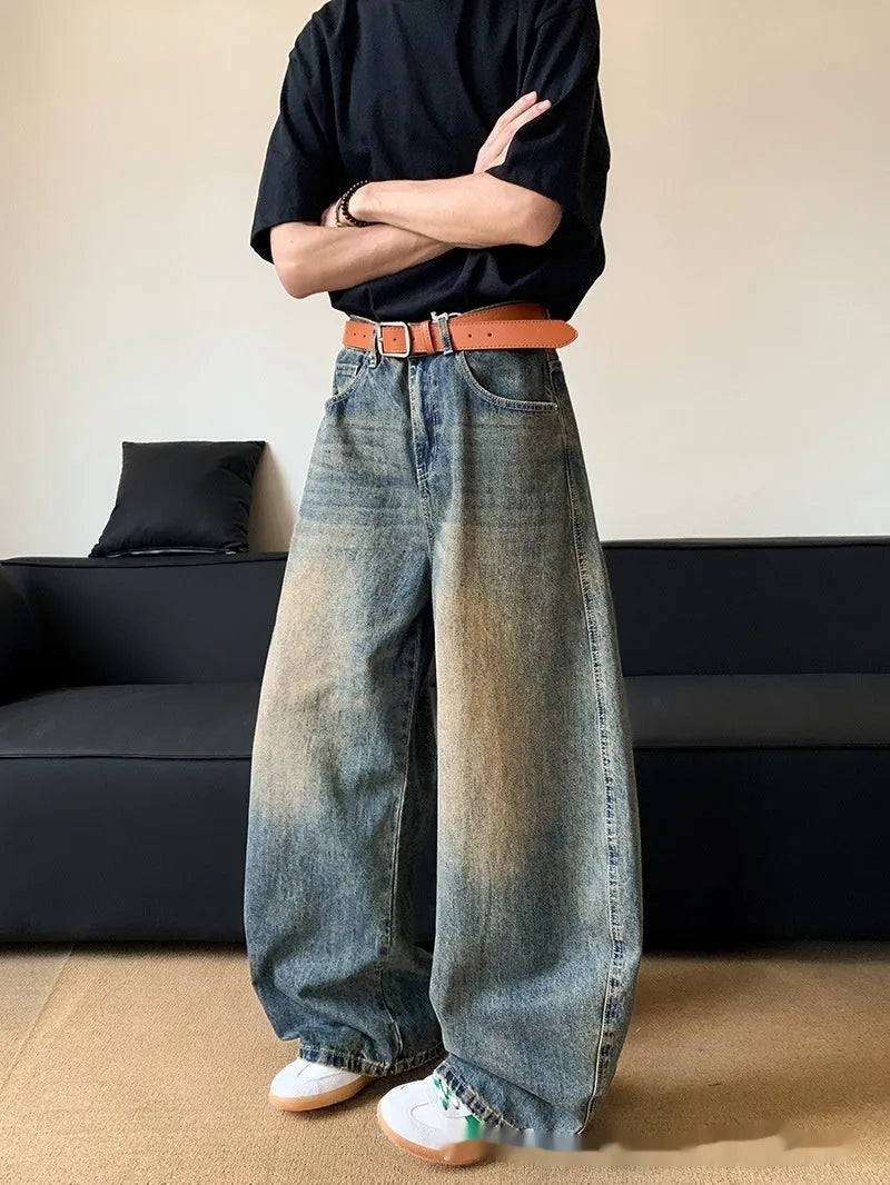 Men's retro blue distressed machete denim jeans with wide-leg silhouette and slim hip fit