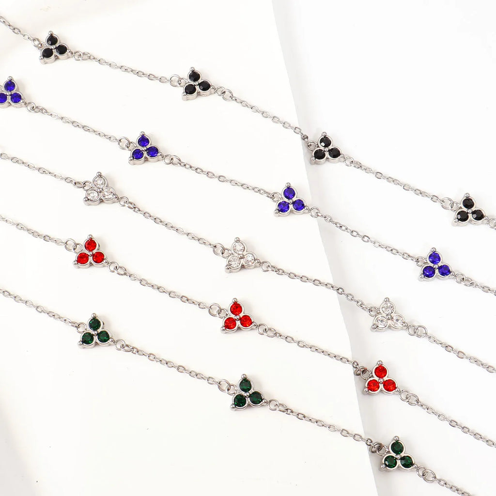 Geometric triangular stainless steel women's bracelet with coloured zircon stones in gold or steel finish.
