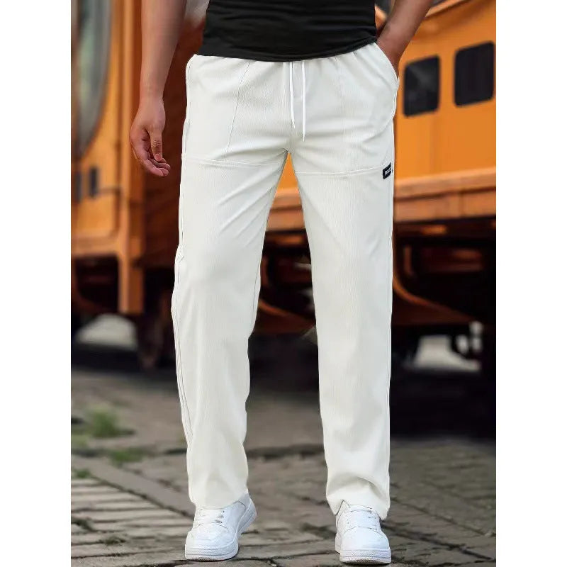 Men's polyester trousers for spring and autumn in light grey colour on a size chart