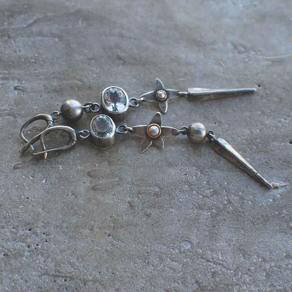 Geometric antique silver long drop earrings with rhinestones and a XINGX design motif.