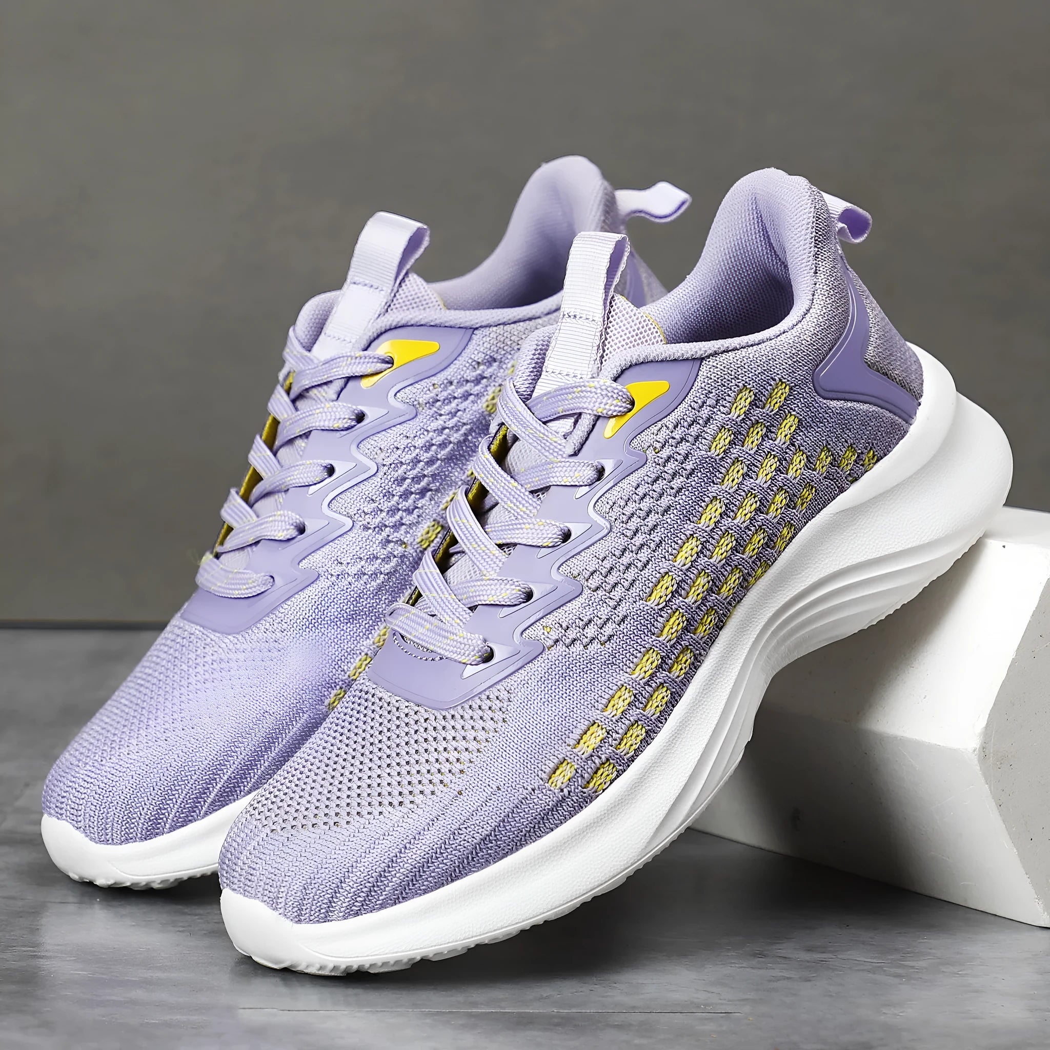 Women's lavender purple flyknit running shoes with mesh lining and striped pattern