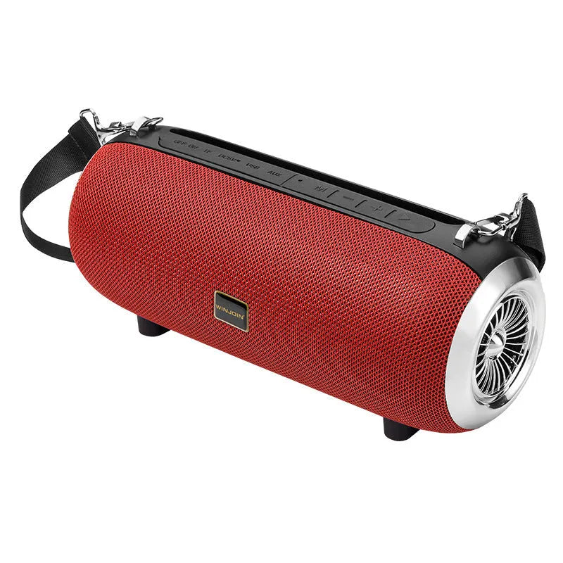 F666 Mini portable Bluetooth speaker with fabric mesh finish, shoulder strap, and standing next to a mobile phone.