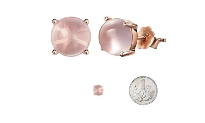 Rose gold drop-shaped stud earrings with crystal inlay detail.