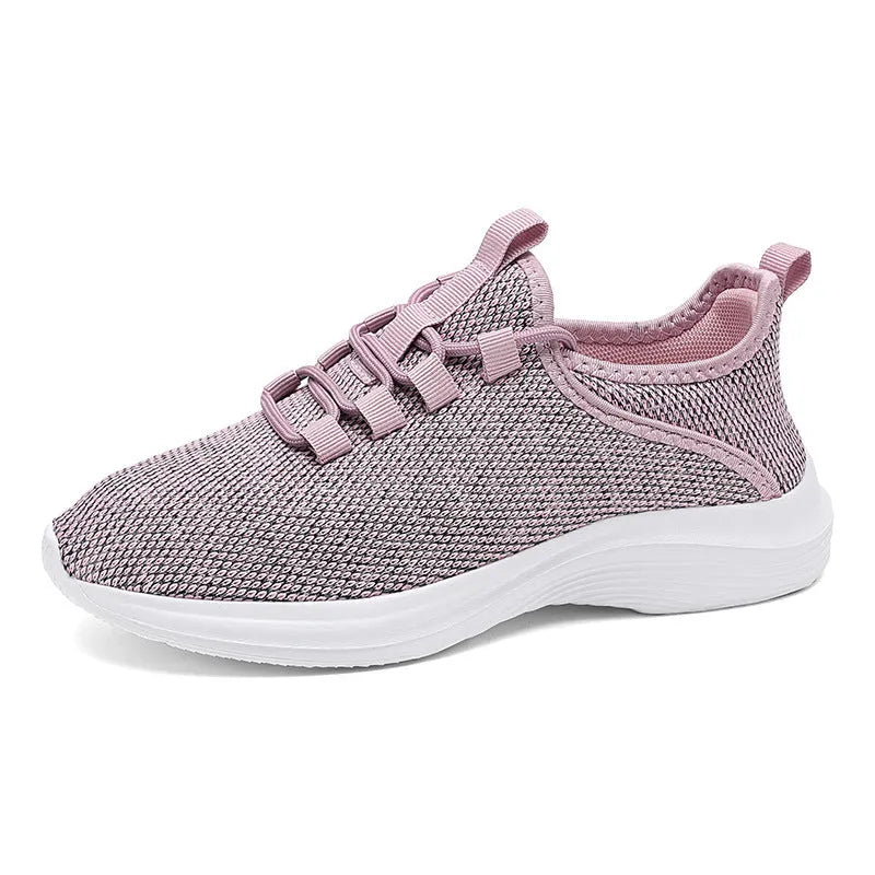 Women's low-top casual sneakers in black, pink or grey with breathable mesh upper and front lace-up fastening.