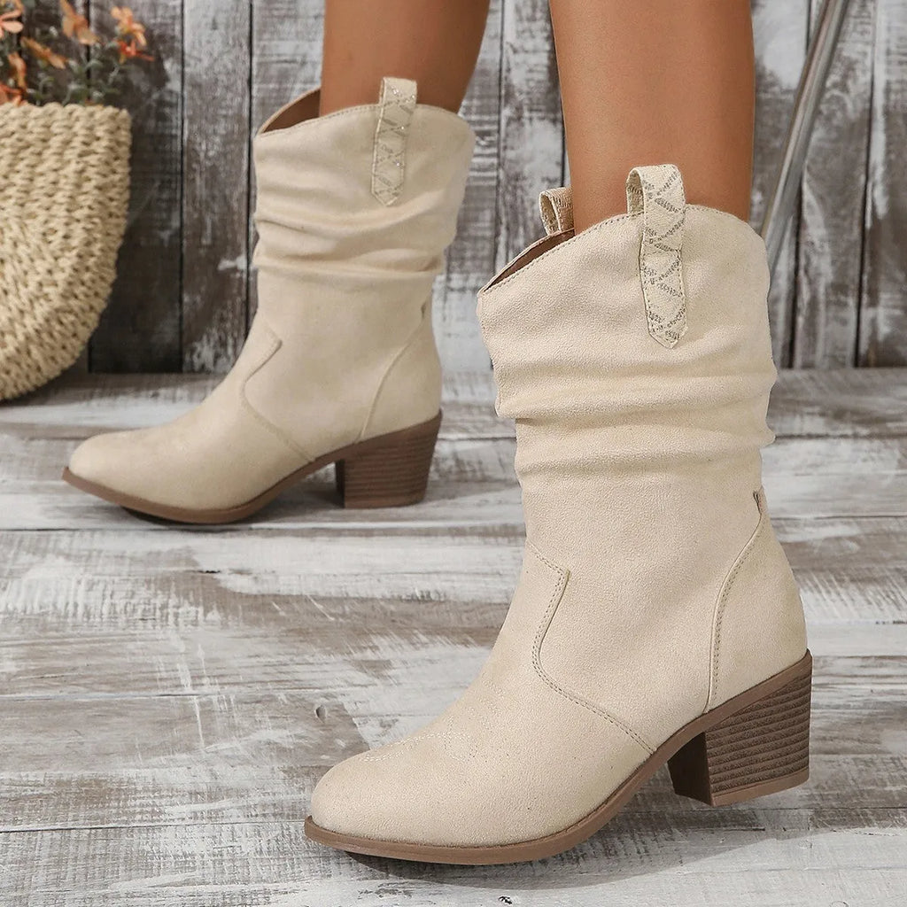 Women's suede mid-calf boots with a pointed toe and mid-height heel, shown in lotus root colour.