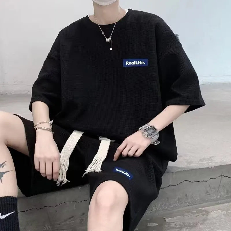 Men's waffle-textured leisure sports suit set with short sleeve top and matching shorts in cotton polyester blend fabric