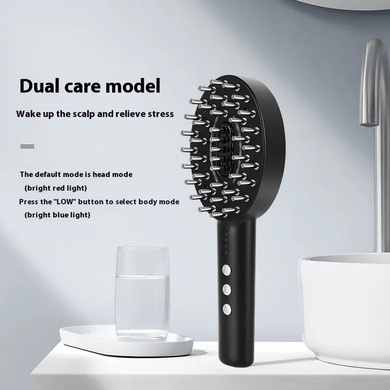 Black handheld electric scalp massage device with a charging cable on a white background.