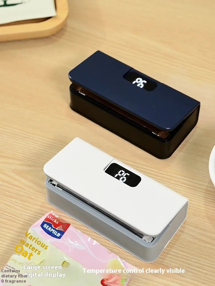 Small blue and white portable manual heat sealing machine for plastic food bags.
