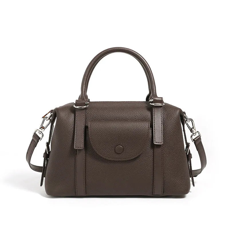 Genuine leather ladies handbag with lock detail in black, brown, or elephant grey.