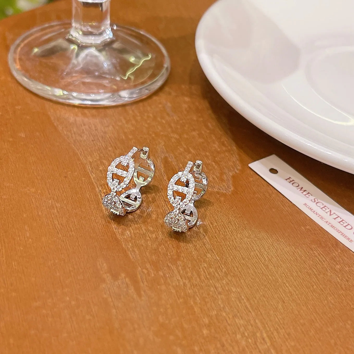 Ladies diamond detail earrings in silver, gold, and rose gold electroplated finishes