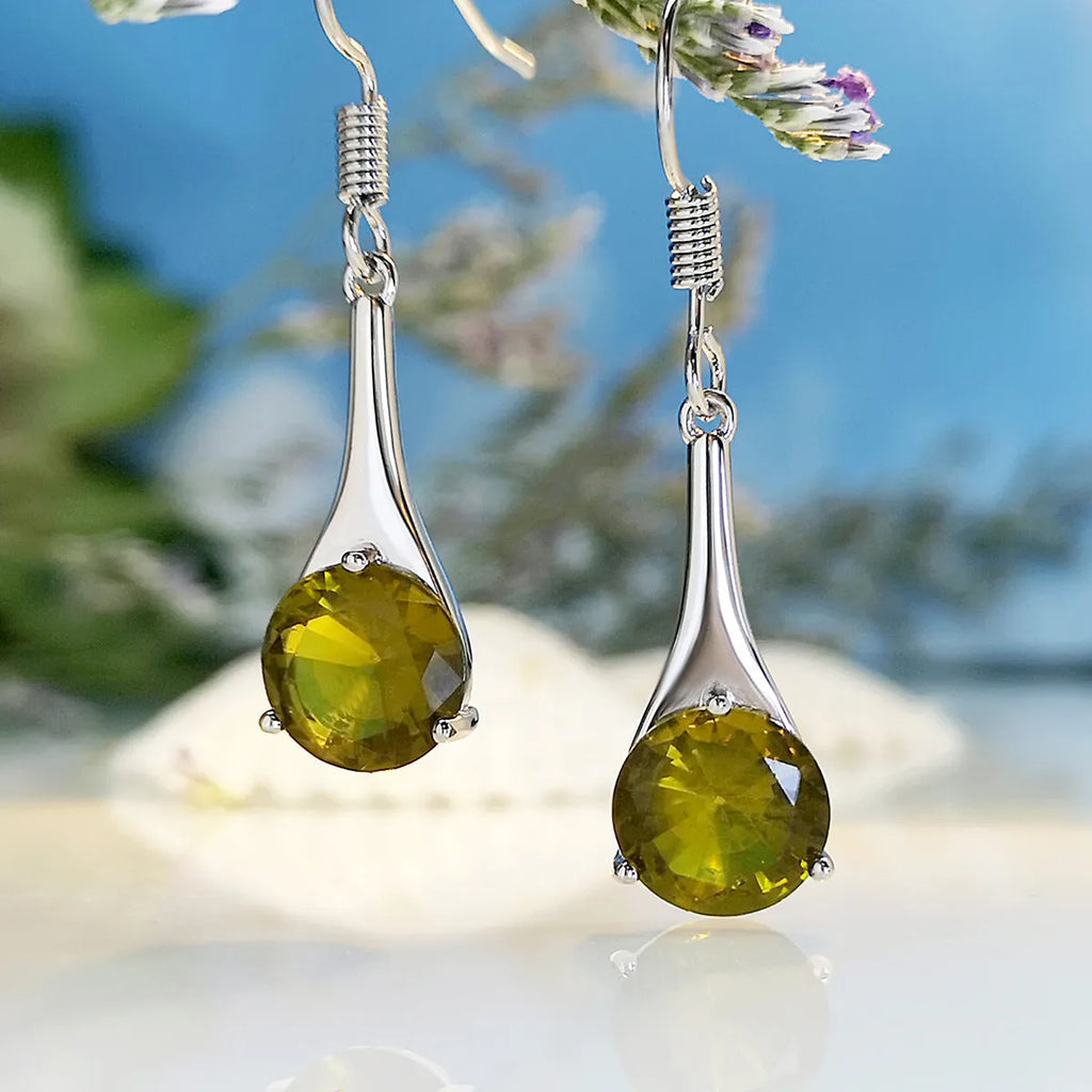 Olive green topaz drop earrings with water drop shape design and alloy construction