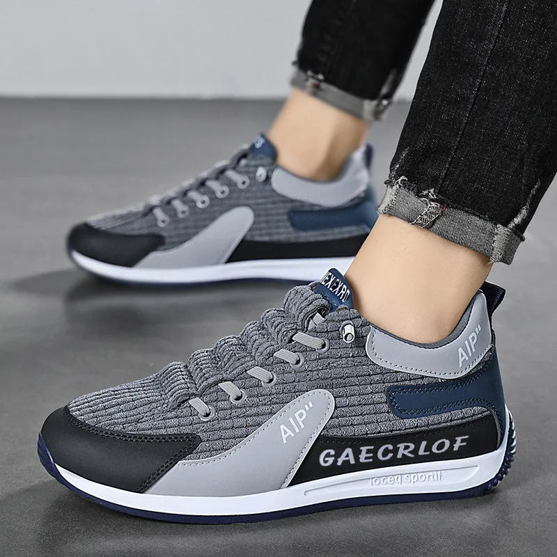 Men's grey and green lightweight mesh running shoes with round toe and lace-up front