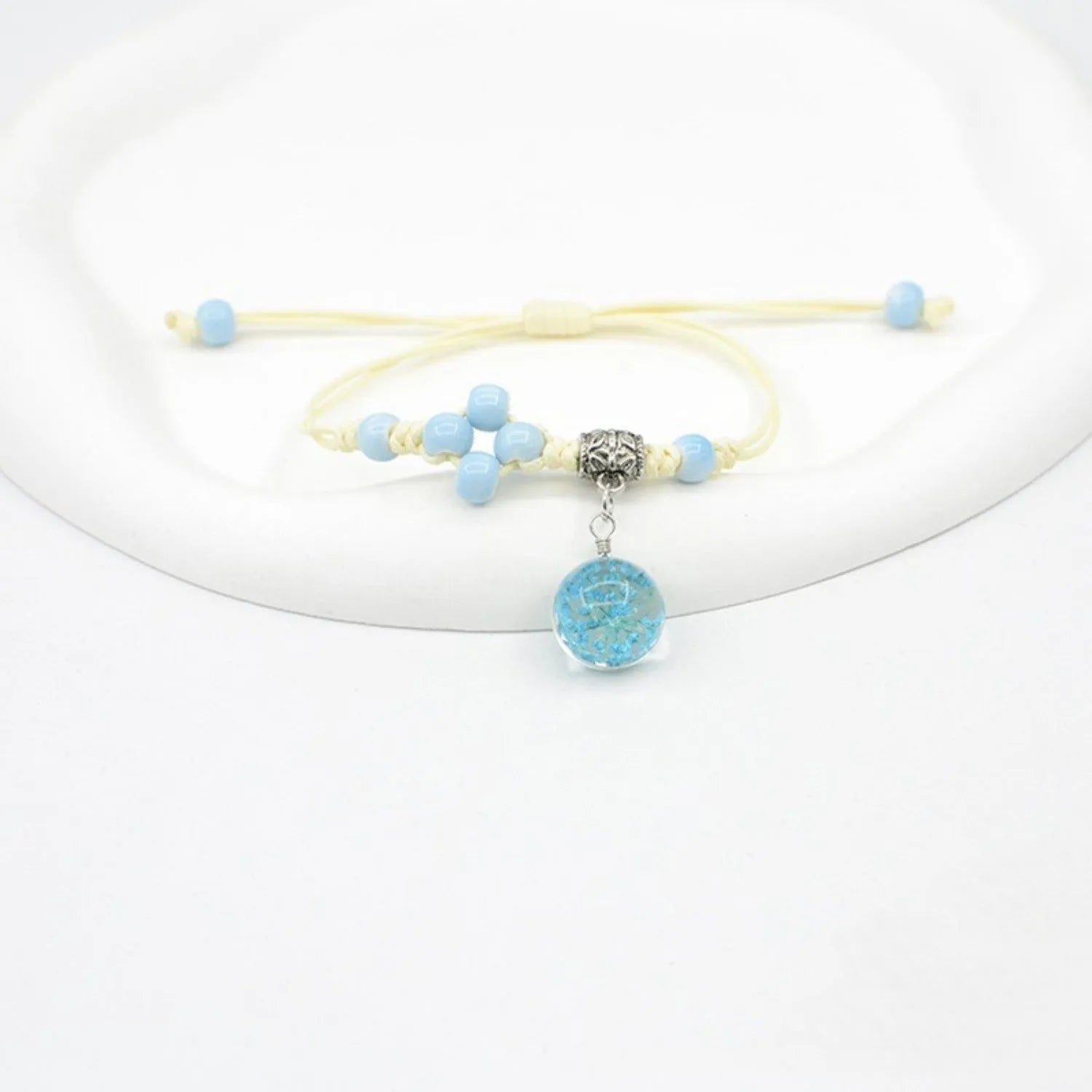 Glass bracelet with dried flowers inside 1.4cm beads on lace-style band in multiple colour options