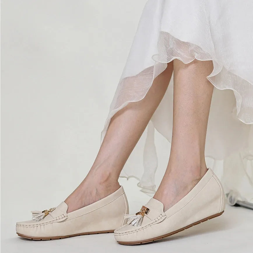 Beige height-increasing mid heel work shoe with round toe, shown as an oversleeve design.
