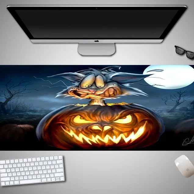 Oversized Halloween-themed gaming mouse pad with non-slip base on a desk.