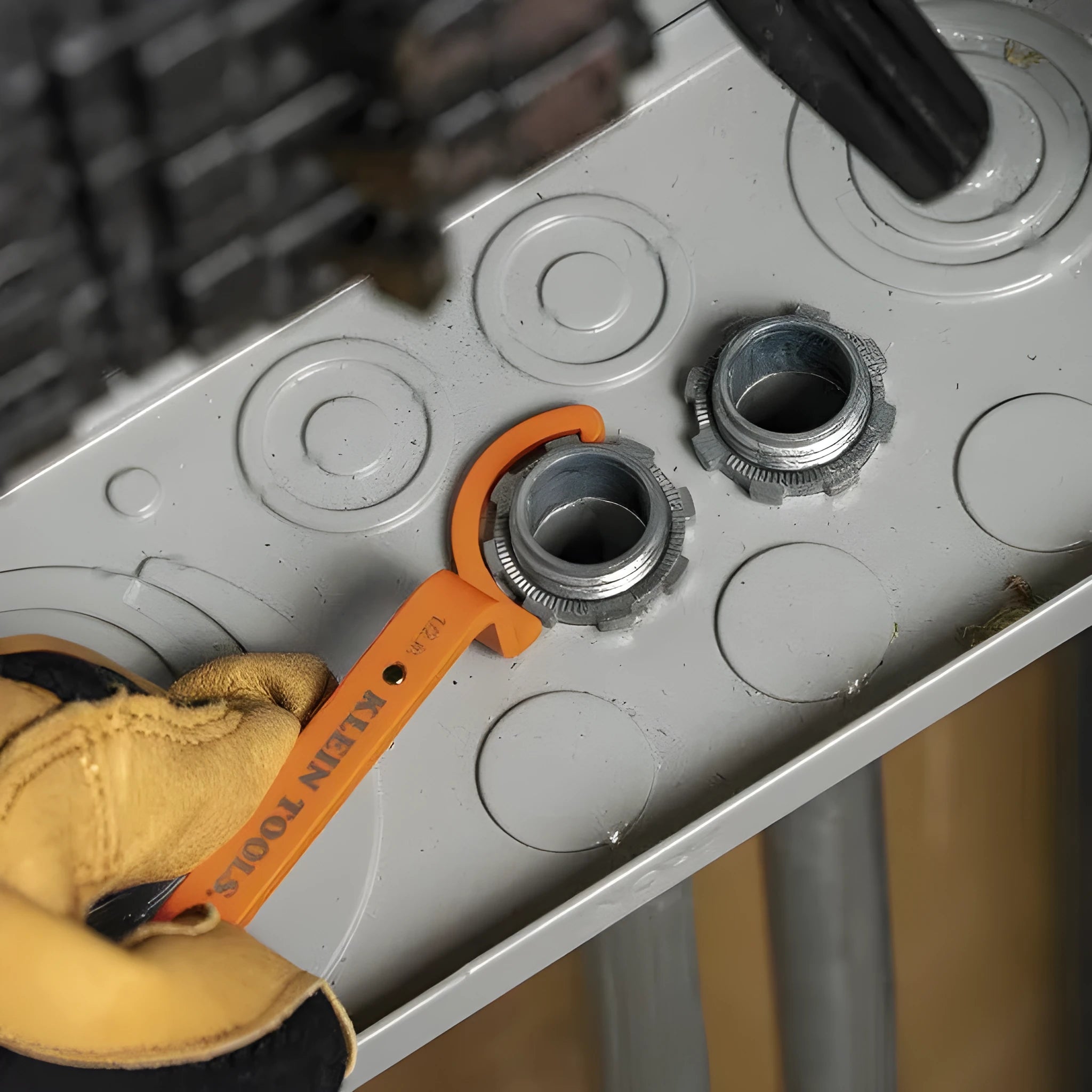 Three magnetic suction wrenches in orange, grey, and black colours with a crescent design.