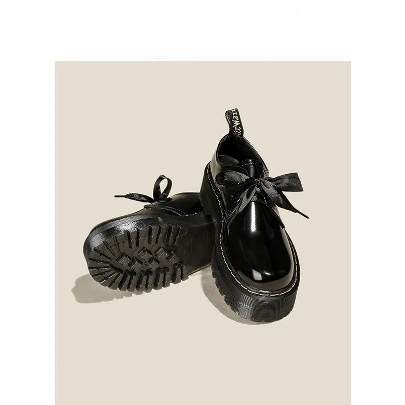 Women's thick soled leather shoes with cross straps and ribbons in black or white colours