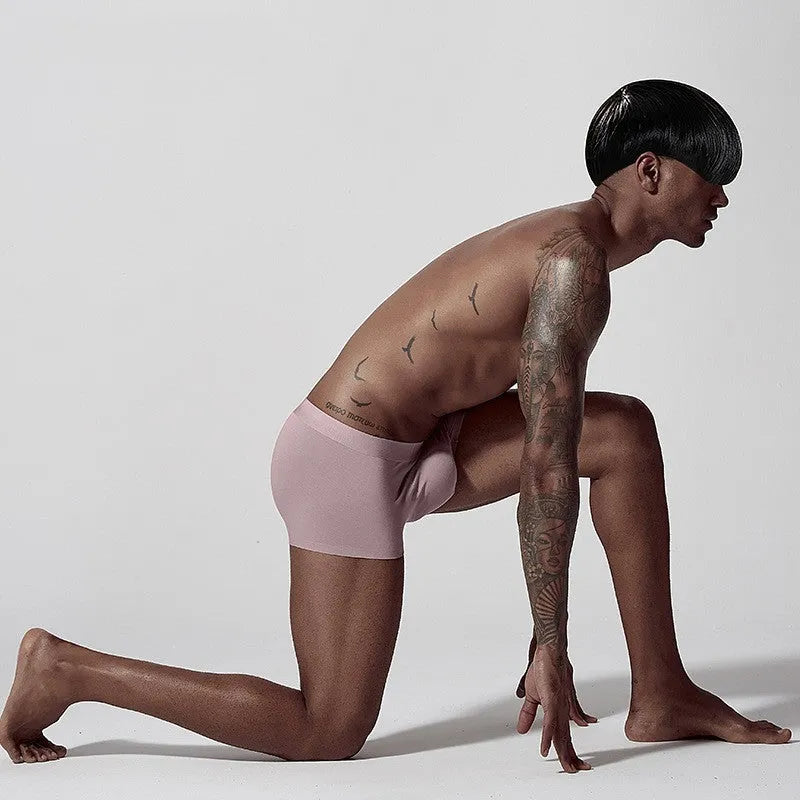 Men's seamless one-piece modal underwear in green on a mid-waist mannequin.