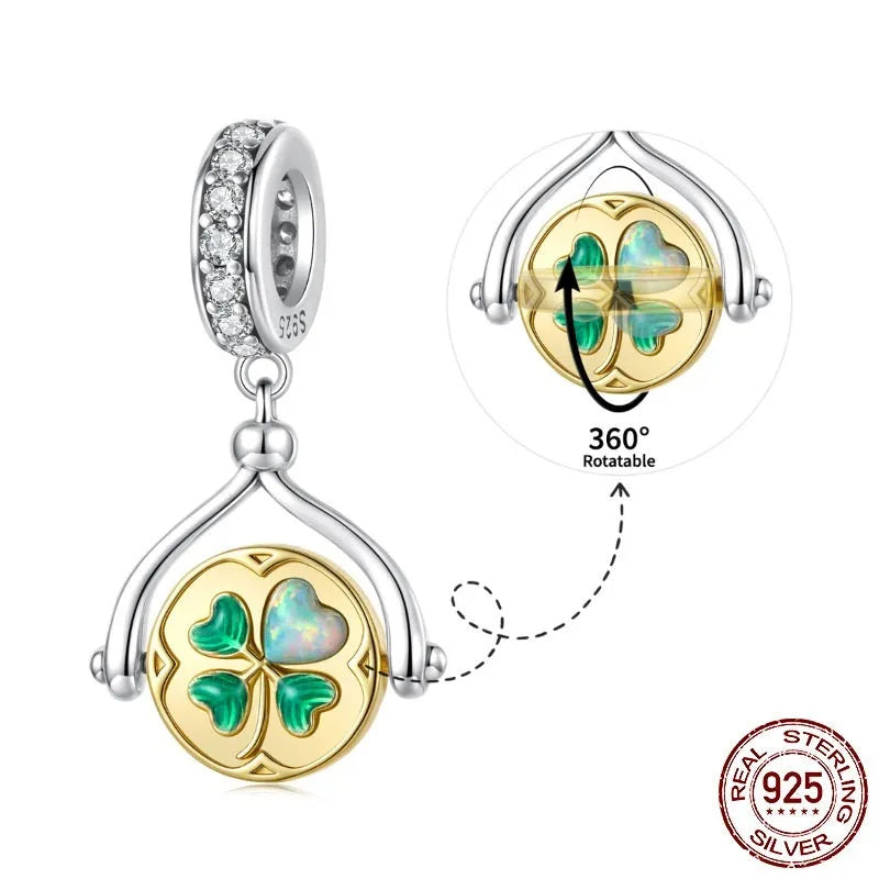 925 sterling silver rotating card pendant with four-leaf clover and wing detail on white background