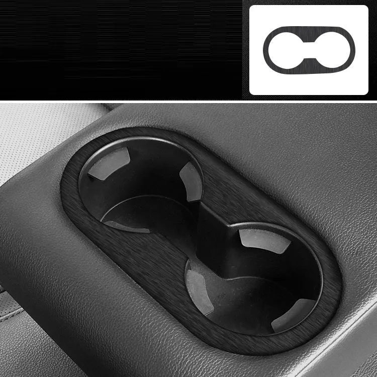 Car interior decorative film sticker kit showing carbon fibre pattern applied to centre console and dashboard