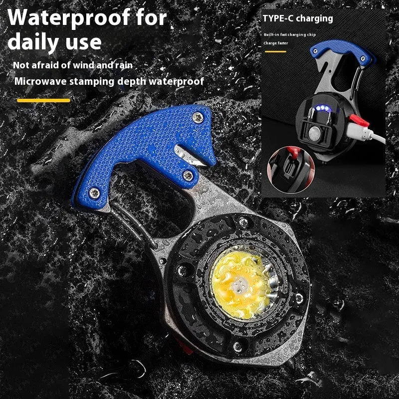 Compact silver and black keychain flashlight with multiple LEDs, a keyring loop, and a pointed window-breaking tip.