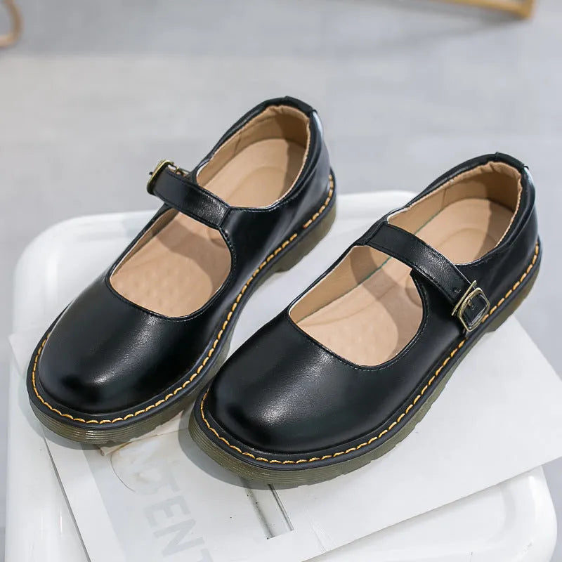 Women's solid colour round head low-cut flat retro shoes with buckle, black colour option, side view
