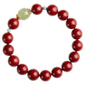 Geometric cinnabar and Hetian jade bead bracelet in purple gold sand colour on a wrist.