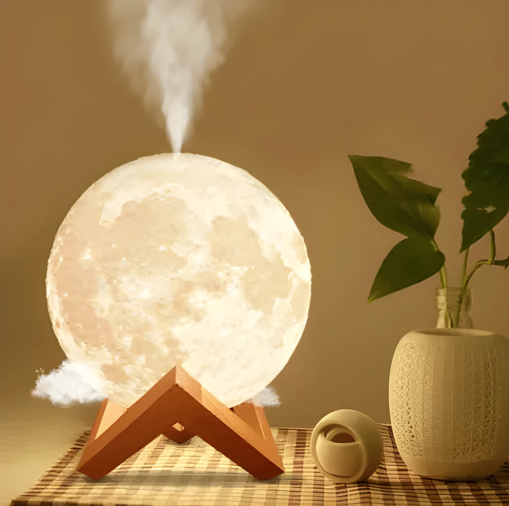 Spherical moon humidifier with LED night light on a bedside table, showing USB charging cable