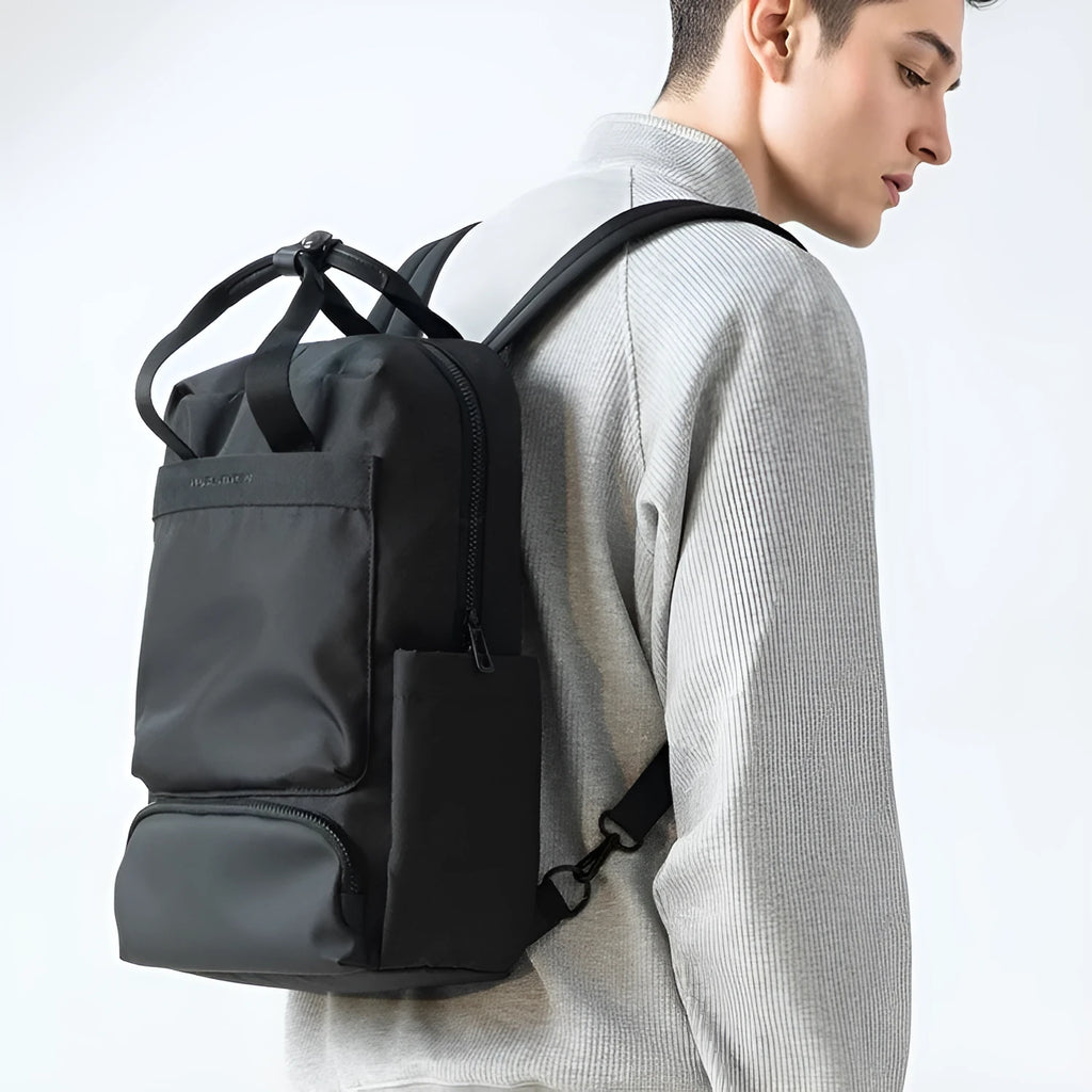 Elegant black Oxford cloth computer backpack with 20-35 litre capacity and polyester lining.