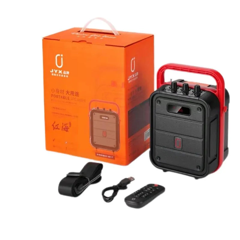 MS62AI black portable Bluetooth speaker with wireless microphone on a table.