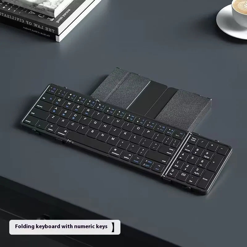 Black folding Bluetooth keyboard unfolded showing full keyboard layout with optional touchpad accessory