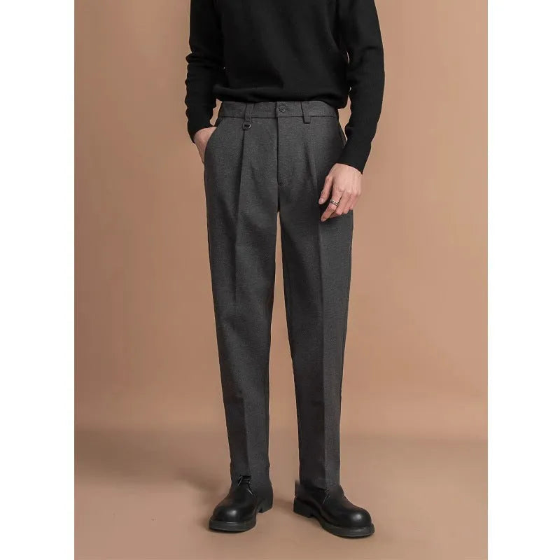 Men's straight leg trousers in dark grey with draped casual styling for winter business casual wear