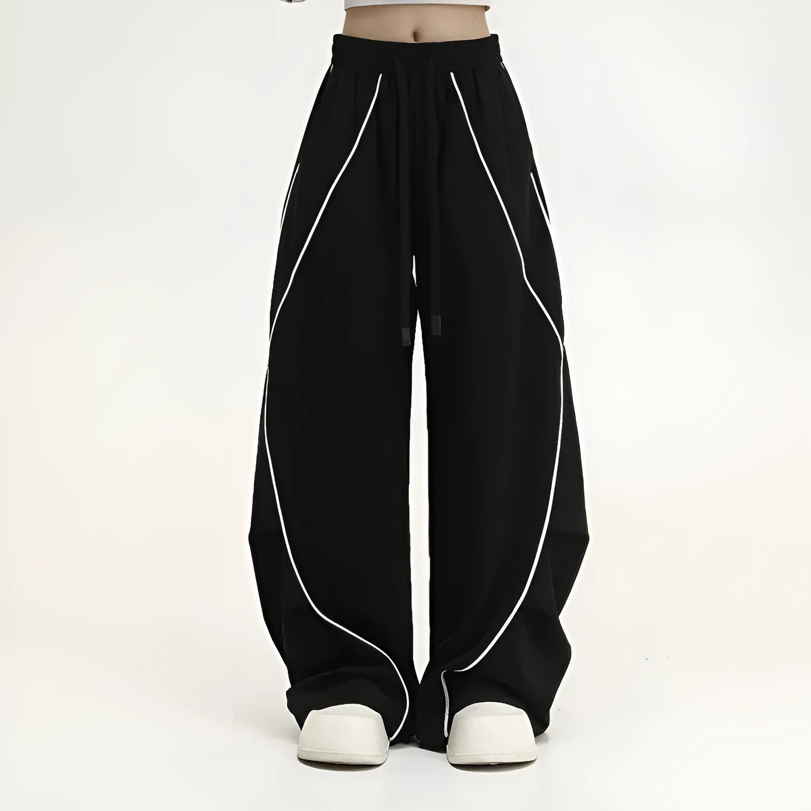 Black pleated wide-leg hip hop trousers with a striped pattern on a mid waist.