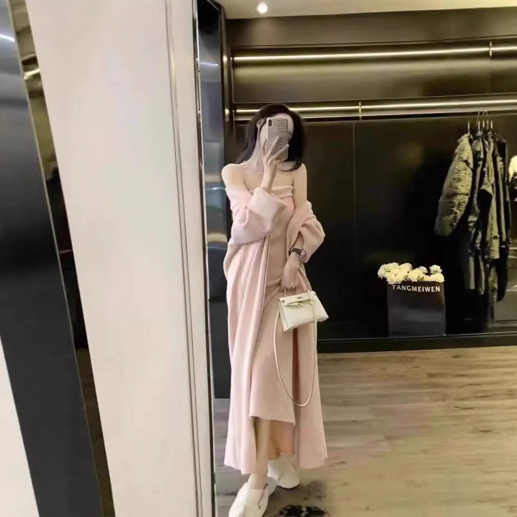 Women's gray knitted cardigan dress suit set with long skirt and regular sleeves.