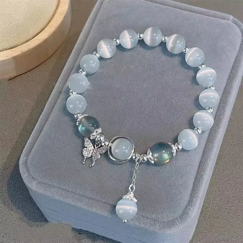 Handmade glass butterfly bracelet in moonlight grey with drop shape design and coloured glass beads