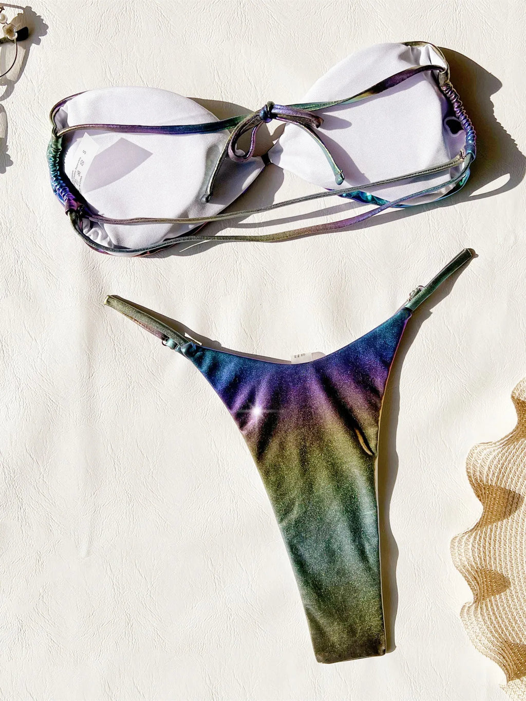 Women's purple gradient bikini swimsuit set on a mannequin, showing the colour transition.