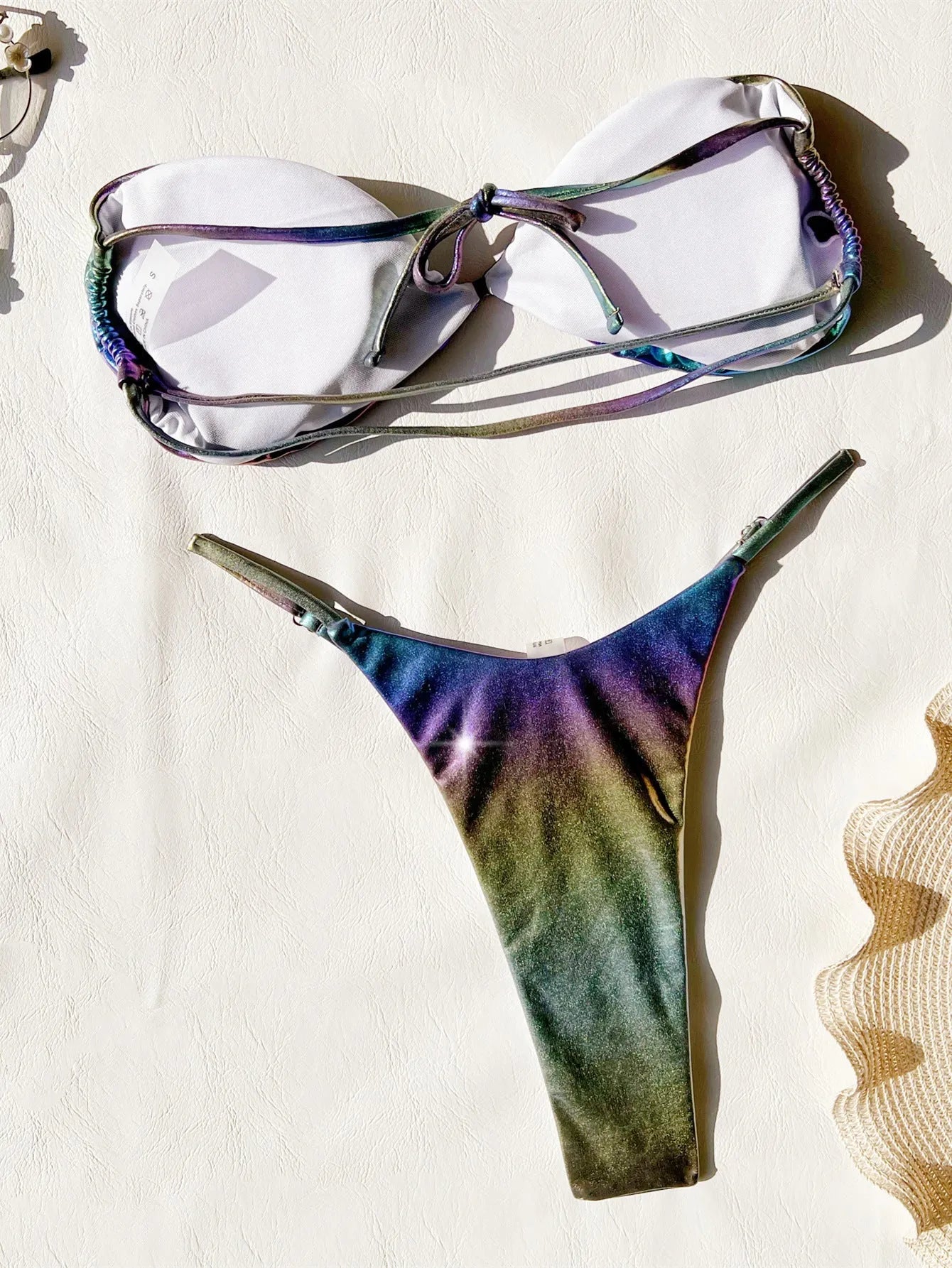 Women's purple gradient bikini swimsuit set on a mannequin, showing the colour transition.
