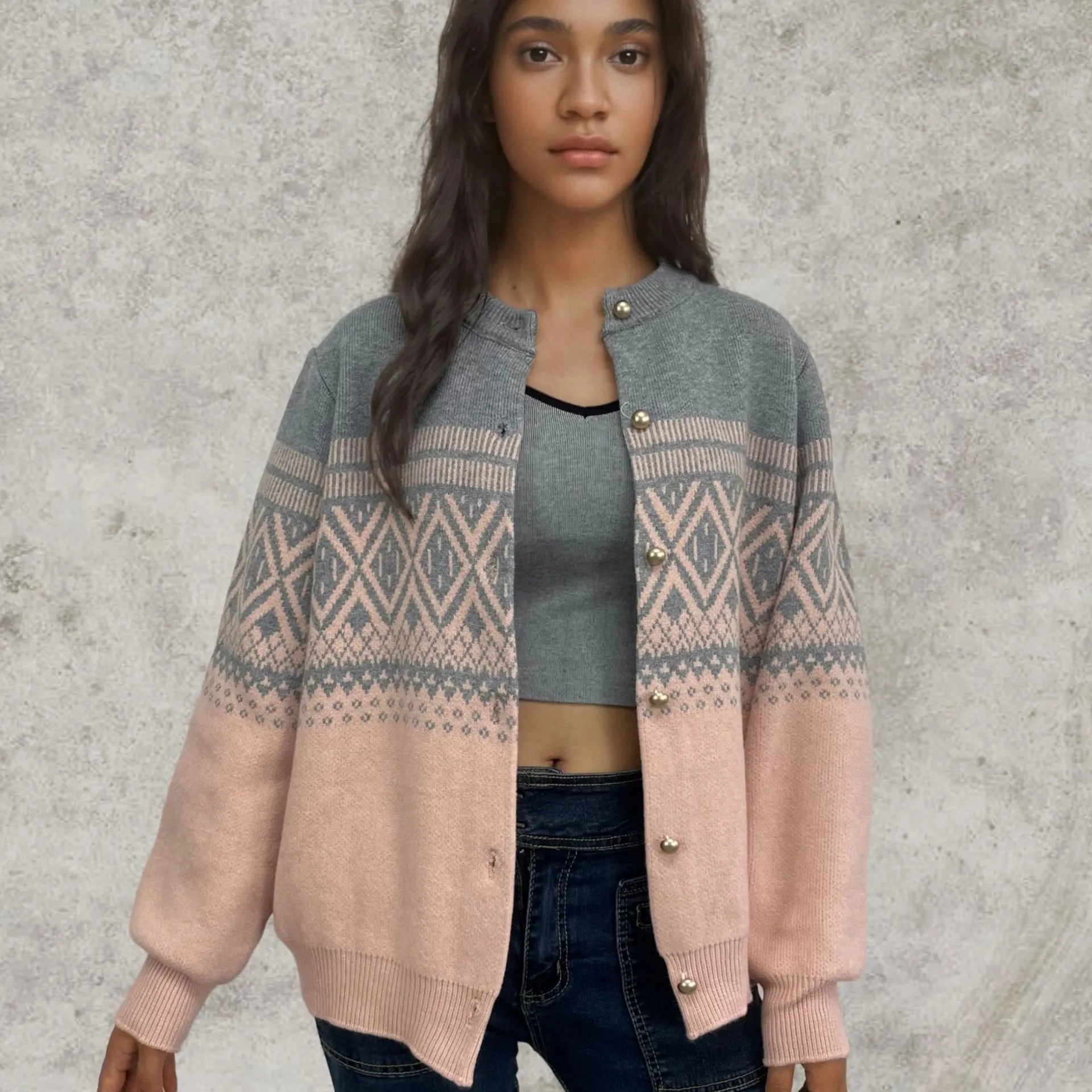 Women's long-sleeved grey alpaca wool cardigan with contrasting diamond knit pattern.